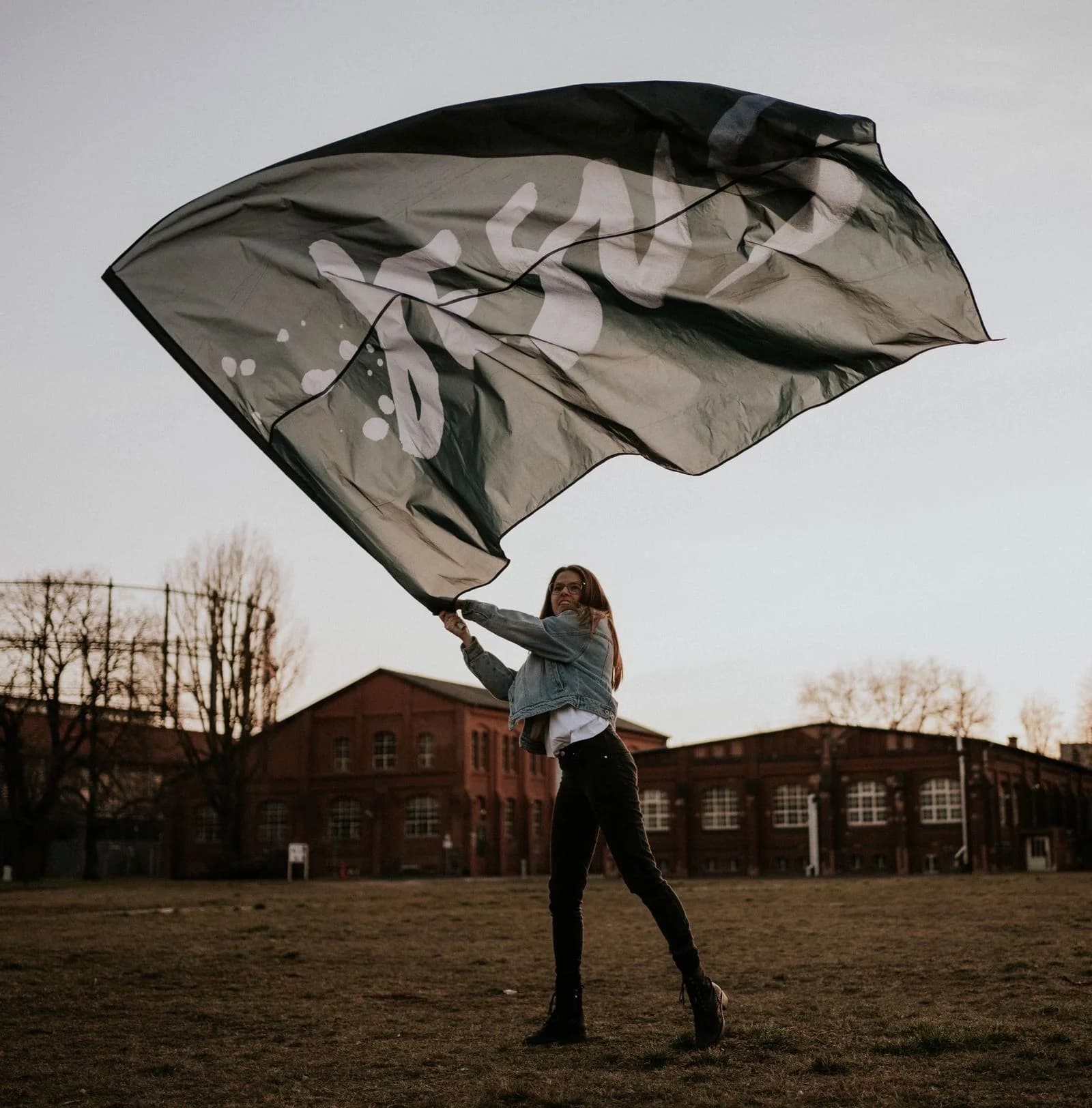 Person waving flag symbolizing freedom of faith